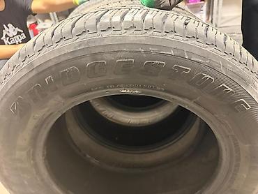 Другие автоуслуги: Комплект из 4 шин Bridgestone Dueler H/T. - Размер: 265/60 R18 - — 21