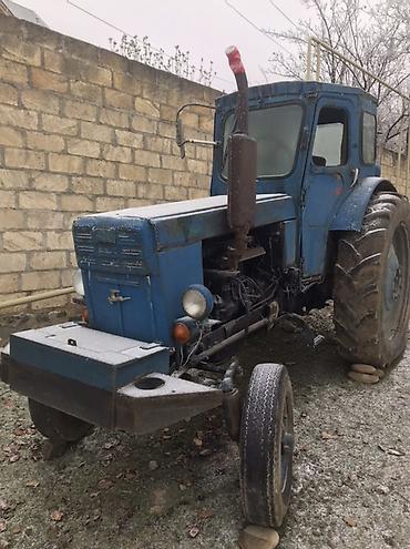 traktor starter: Məhsul: Mavi rəngli təkərli traktor və kənd təsərrüfatı aqreqatları — 1