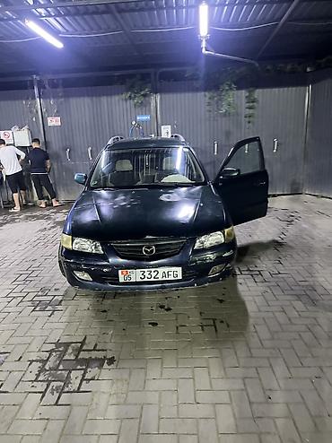коричневый салон: Mazda Capella: 2001 г., Бензин, Универсал — 7