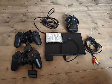 islenmis paltaryuyan: Playstation 2 prosivka içində playstation 2 və bir oyunları var — 1
