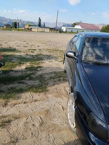 короми: Toyota Carina E: 1999 г., Бензин, Седан — 2