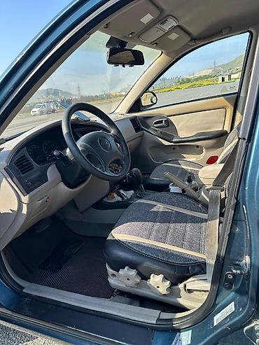 karopkalar: Hyundai Elantra: 2 l | 2003 il Sedan — 2