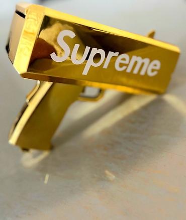 oyuncaq pul: Məhsul: Supreme qızılı “Money Gun” (pul atıcı) Təsvir: - Parlaq — 2