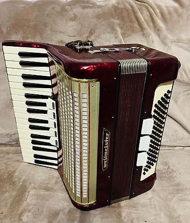 Аккордеоны: Аккордеон Weltmeister (кнопочно-клавишный), красный перламутровый — 9