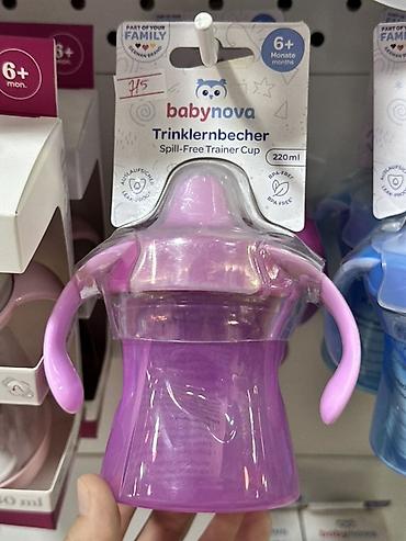 Детский мир: Детская обучающая поильная чашка babynova Trinklernbecher (Spill‑Free — 1