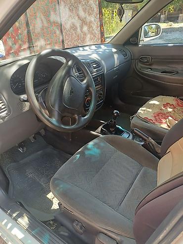 седло на даф: Daewoo Nubira: 1997 г., Механика, Седан — 1