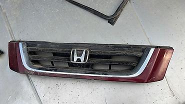 Решётка радиатора Honda с центральной эмблемой «H». - Оригинальная