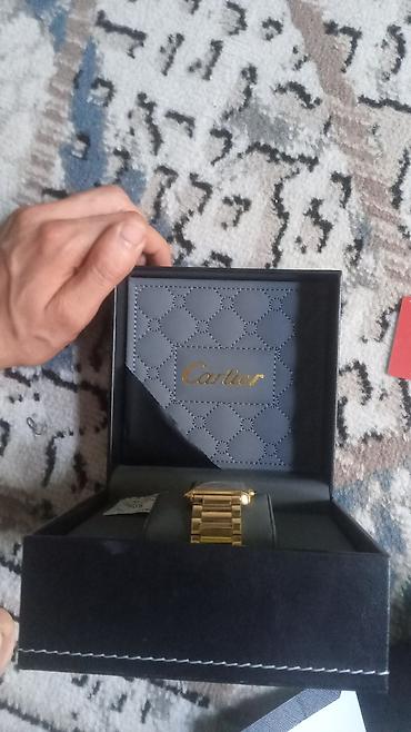 Aksesuarlar: Brend: Cartier (qutu və aksesuarlarla) Model: Düzbucaqlı kadranlı — 3