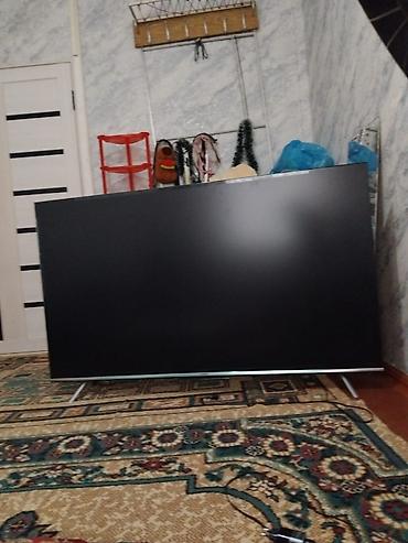 ми 9 с: Большой LED-телевизор на ножках - Диагональ примерно 55–65 дюймов — 1