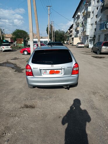 демио машина: Mazda 323: 2001 г., 1.6 л, Механика, Бензин, Универсал