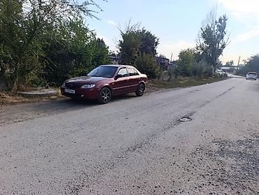 demio sport: Mazda 323: 2001 г., 1.8 л, Автомат, Бензин, Седан — 10