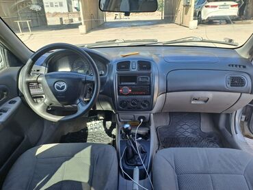 деловые автомобили: Mazda 323: 2002 г., 1.6 л, Механика, Бензин, Хэтчбэк