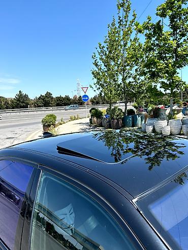 e39 guzgu: BMW 5 Series E39 sedan – qara rəng, M-paket üslublu eksteryer — 9