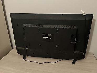 lcd tv: Телевизор Sharp (диагональ около 40–43"). Классический ЖК‑экран с — 2