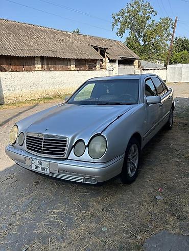 radiator mercedes: Mercedes-Benz E-Class (W210) sedan – gümüşü rəng. - Kuzov: 4 qapılı — 5