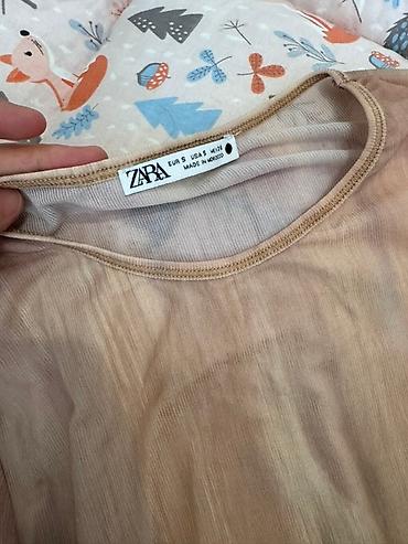 Айымдардын кийими: Боди с длинными рукавами и принтом тай-дай от Zara. Модель имеет — 2