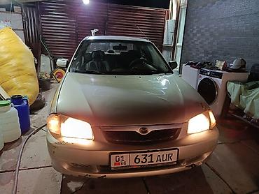 bmw 100: Mazda 323: 1999 г., 1.5 л, Автомат, Бензин, Седан — 3
