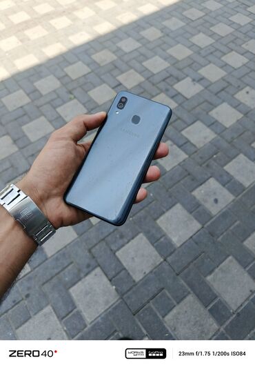 telfonlar a51: Samsung Galaxy A30, 32 GB, rəng - Boz, Düyməli, Barmaq izi, Face ID