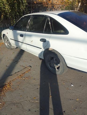 bud e9: Продаётся легковой автомобиль белого цвета (седан). Основные — 9