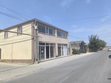 lokbatan bina az: İki mərtəbəli, düzbucaqlı formada, künc yerləşməli bu bina ofis