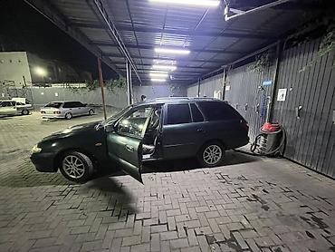коричневый салон: Mazda Capella: 2001 г., Бензин, Универсал — 8