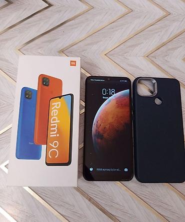 redmi note 9 lite: Redmi 9C, 128 GB, rəng - Qara, Zəmanət, Barmaq izi, Simsiz şarj — 1