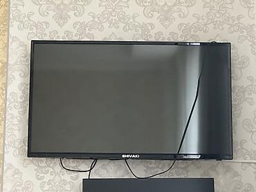 телевизор шиваки: Телевизор SHIVAKI, диагональ около 32–40". Тонкая рамка, крепление — 1