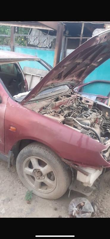 bye e2: Nissan Almera (седан), красный цвет, кузов P11. Описание: - — 10
