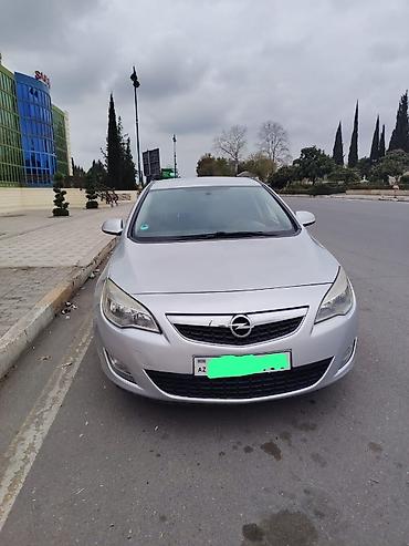 qazel yuk masin: Opel Astra hatchback – gümüşü rəng Kuzov: 5 qapılı hatchback Mühərrik — 3