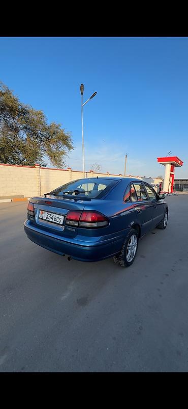 260: Mazda 626: 1997 г., 1.8 л, Механика, Бензин, Хэтчбэк — 8