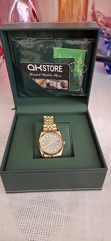 swatch saati: Rolex tərzində kişi qol saatı – qızılı korpus və Jubilee tipli metal — 2