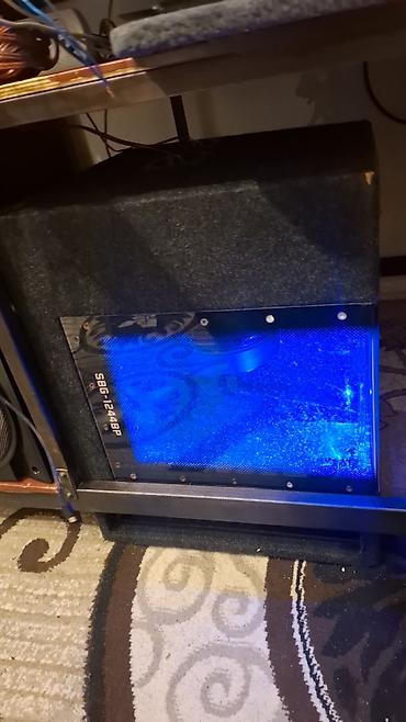 qapi dinamikləri: Səs sistemi üçün korpus tipli subwoofer satılır. Şəkildə üzərində — 1