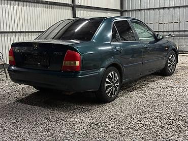 мини электро: Mazda 323: 2000 г., 1.3 л, Механика, Бензин, Седан — 6