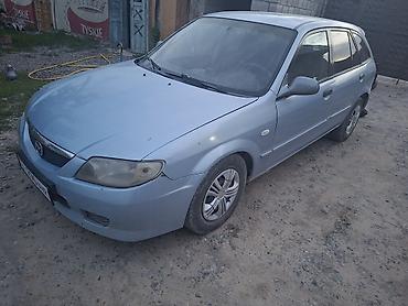мтз 92 п: Mazda 323: 2002 г., 1.6 л, Механика, Бензин, Универсал — 3