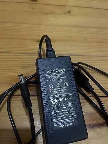 Техника и электроника: AC/DC adapter/şarj cihazı Model: XHK-916-42015 Giriş (Input) — 2