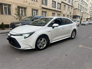 xpeng g3: Toyota Corolla: 2022 г., 1.8 л, Вариатор, Гибрид, Седан — 1