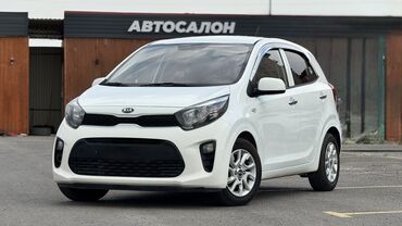 алифарт машина: Белый хэтчбек Kia morning, предназначенный для городской езды. Модель