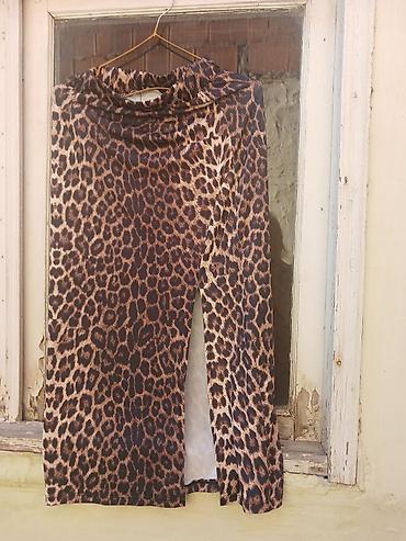 Qadın geyimləri dəsti 1) Yubka – leopard naxışlı - Kəsim: düz siluet