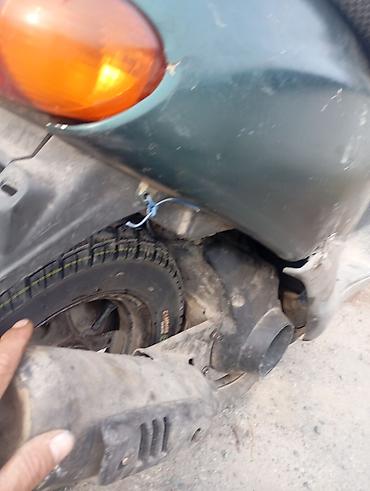 скутер ондоо: Скутер 50 см³ (ориентировочно, класс Honda/Dio) зеленого цвета. ЗАДНЕЕ — 4