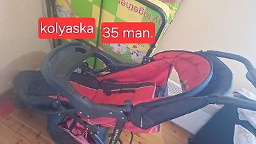 Uşaq arabası – kolyaska - Rəng: qırmızı-qara - Təkərli yürüş sistemi