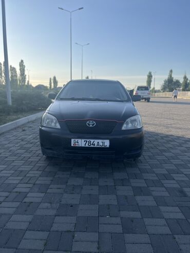 эн арзан машина: Автомобиль Toyota Corolla черного цвета. Практичный седан с просторным
