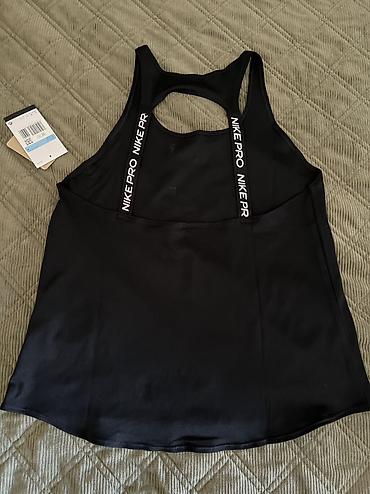 aksa: Nike Pro Women's Dri-FIT Tank Top vel. S, M 
Recycled Materials
IB — 7