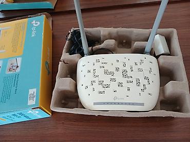 internet mini modem: TP-Link Wi‑Fi router - Model: TP-Link (qutuda “300 Mbps Wi‑Fi” və “N” — 3