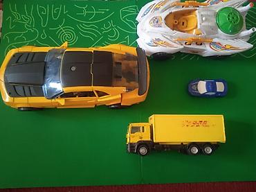 Другие игровые комплексы: Детские игрушеки транспорт и герои Состав: - Разнообразные машинки — 5