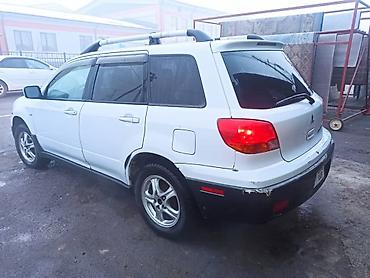 где принимают аккумуляторы: Mitsubishi Outlander: 2003 г., 2.4 л, Автомат, Газ, Кроссовер — 3