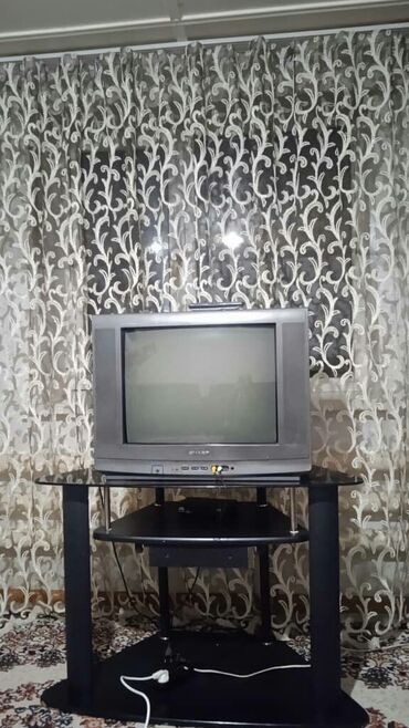 телевизор сатып алам: Телевизор ШАРП- 800с.
Полка под ТВ.-700с. 
Приставка- 200с