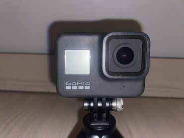 ноутбук планшет леново: Черная экшн-камера GoPro, установленная на компактный мини-штатив