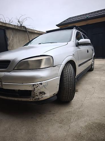 Opel: Opel Astra Caravan (universal) – gümüş rəngli kuzov, 5 qapı, dam — 7