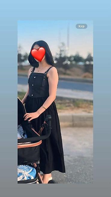 uzun bot: Qara rəngli uzun qadın donu. Model nazik çiyin qayışlıdır və ön — 2