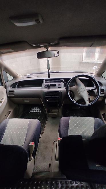 Другие детали салона: Honda (правый руль), салон минивэна. Описание: - Просторный 2‑рядный — 4